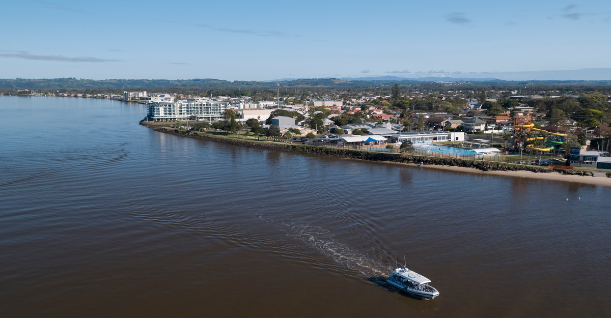 Aerial of Out of the Blue Adventures cruising up the Richmond River in Ballina.