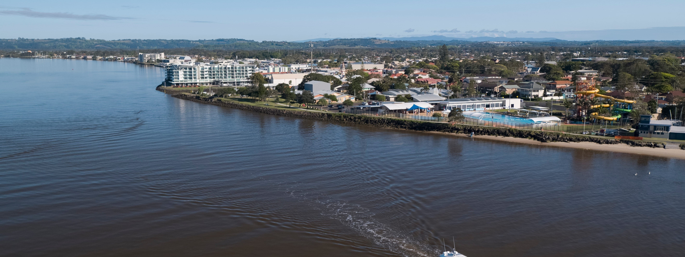 Aerial of Out of the Blue Adventures cruising up the Richmond River in Ballina.