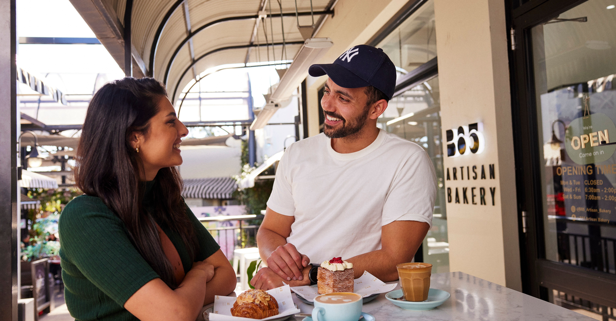 Couple enjoying a coffee and baked treat at B85 Artisan Bakery in Camden.