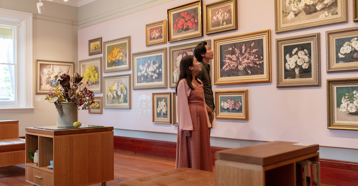 Couple enjoying a visit to Camden Fine Art Gallery, Camden in Sydney's south west.