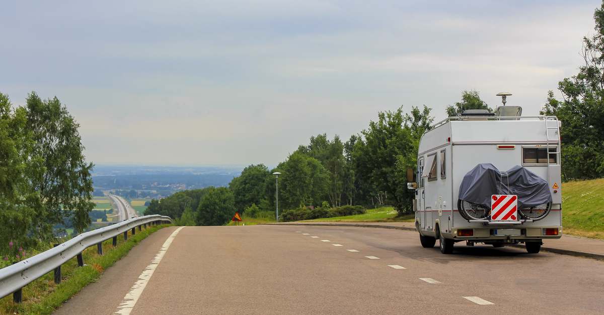 Caravan camper on the road from the rest area to the motorway somewhere in Sweden.