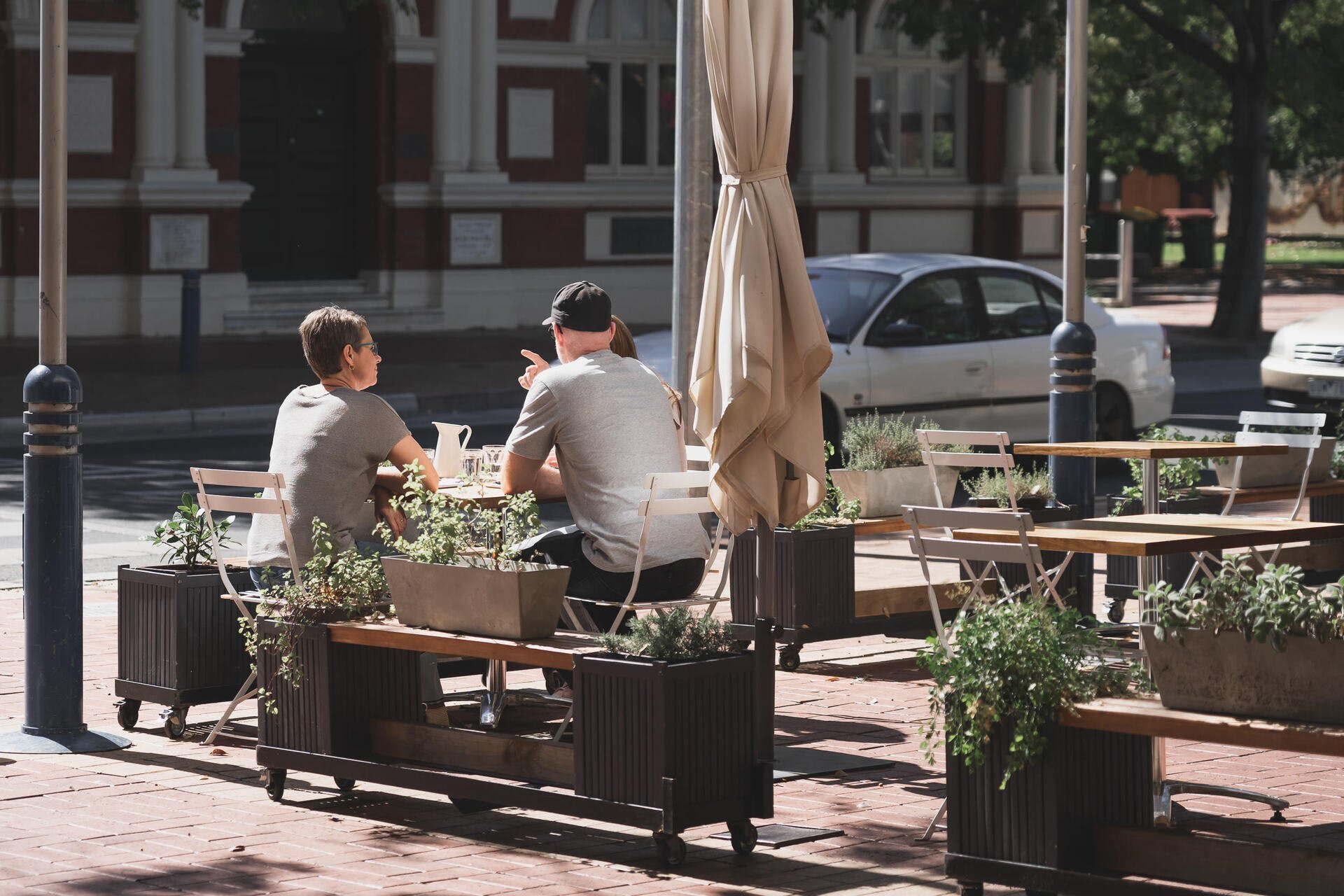 Diners seated at an outdoor cafe in Albury CBD.