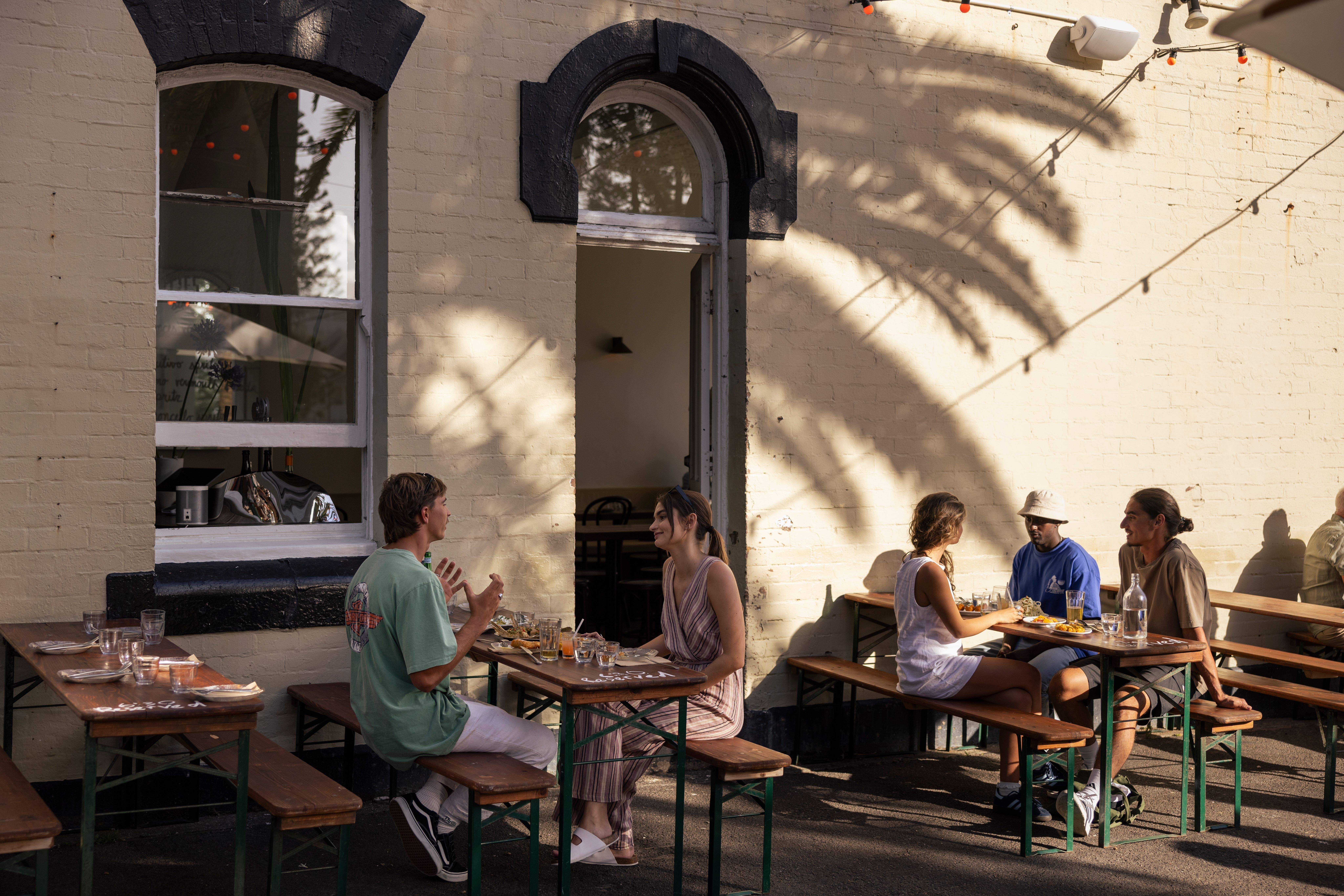 Friends enjoy food and drink at Scottie's, Newcastle#asset:58860@1:alt