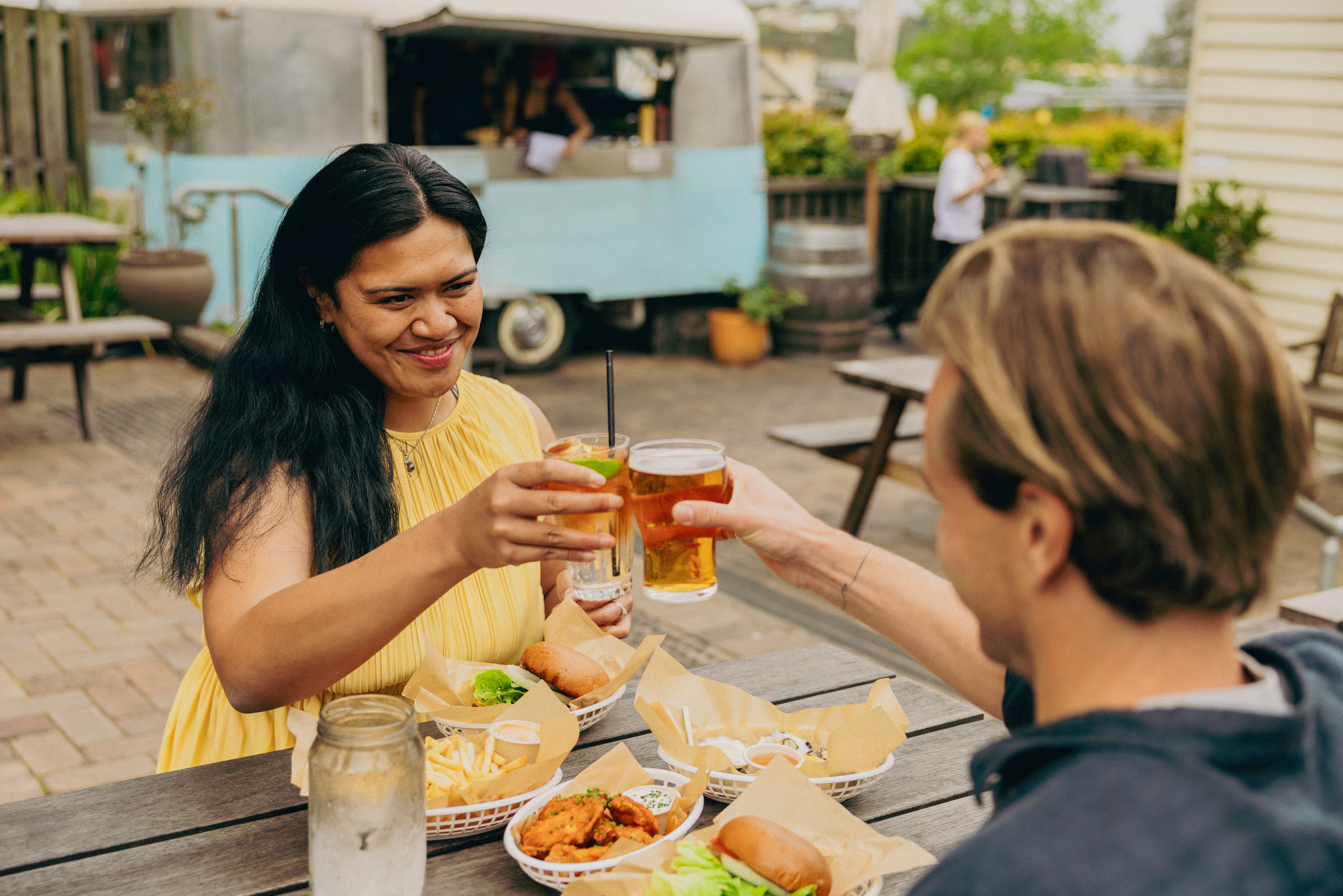 Couple enjoying food at Dulcie’s Cottage.