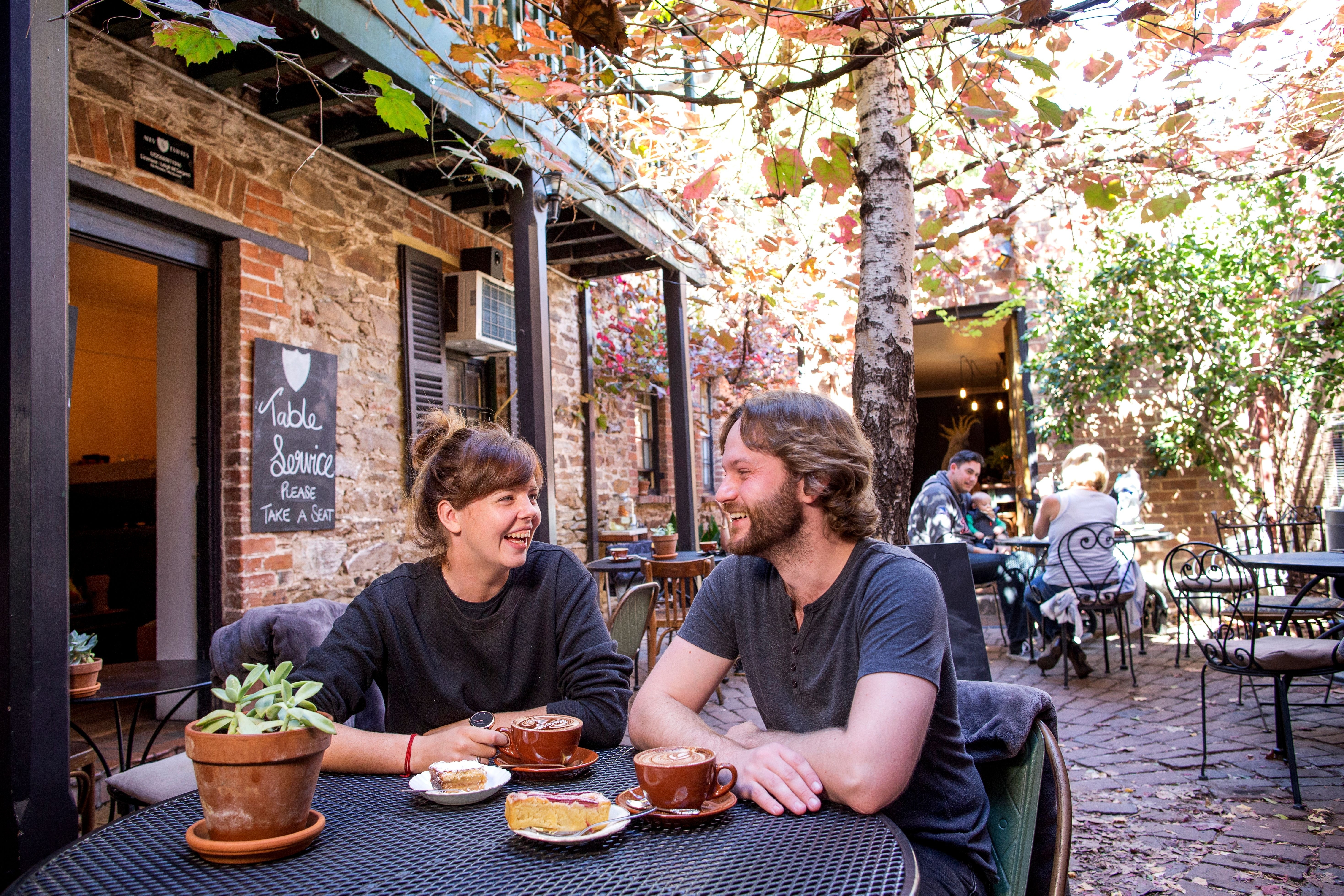 Couple enjoying a relaxing breakfast in Alby + Esters, Mudgee.