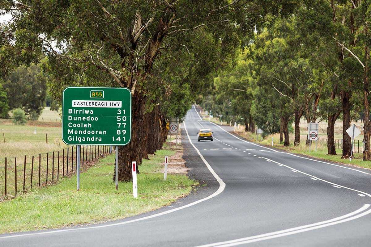 Castlereagh Highway road sign showing distances to Birriwa, Dunedoo, Coolah, Mendooran and Gilgandra.