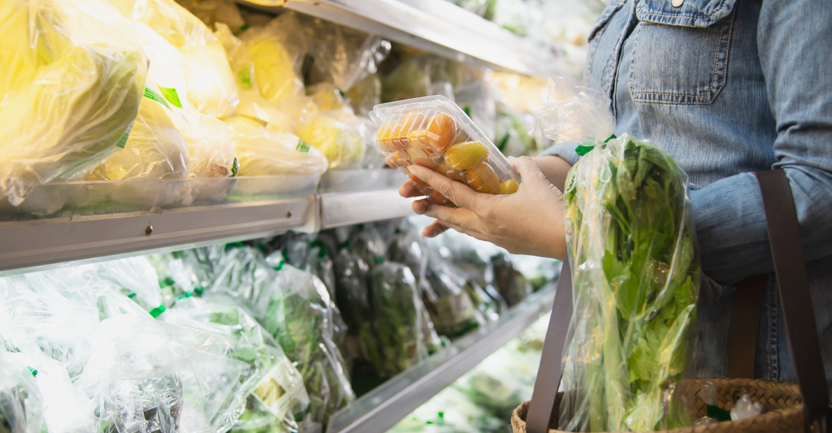 Lady is shopping fresh vegetable in supermarket store - woman in fresh market lifestyle concept