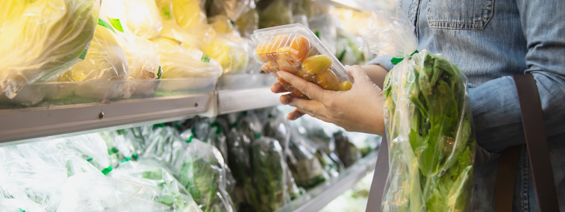 Lady is shopping fresh vegetable in supermarket store - woman in fresh market lifestyle concept