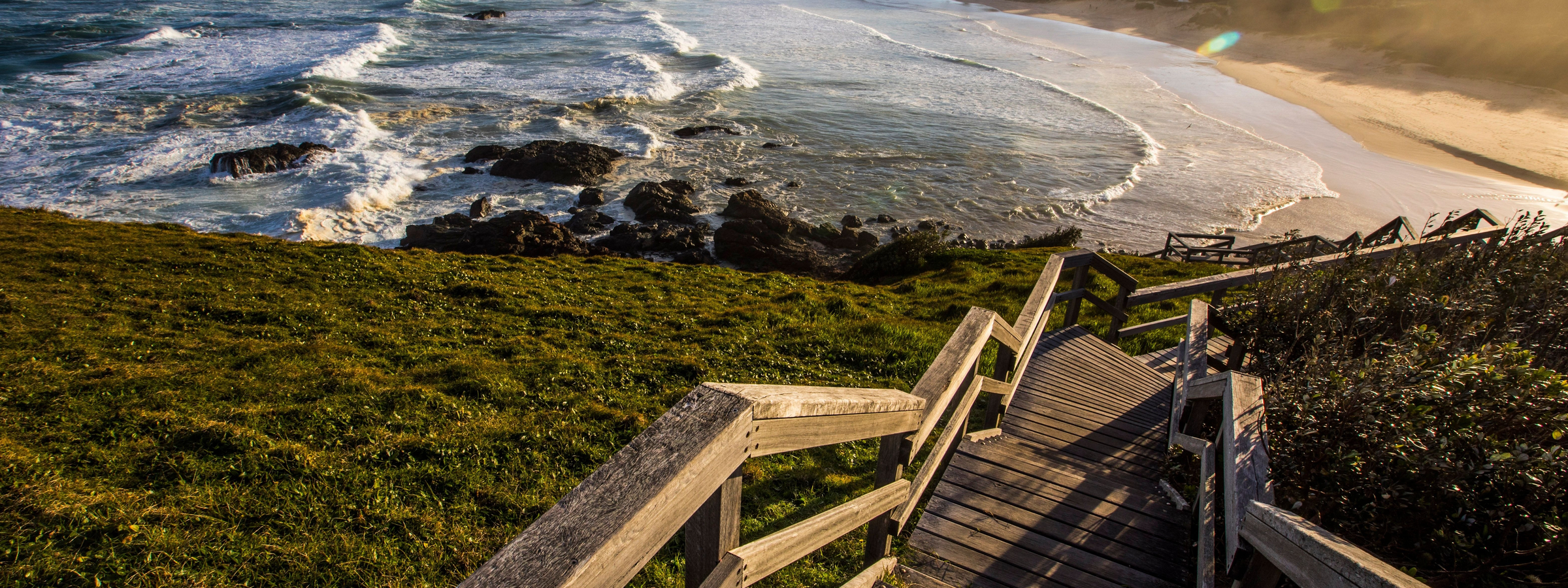 Stairs leading down to a beach along the Port Macquarie Coastal Walk.